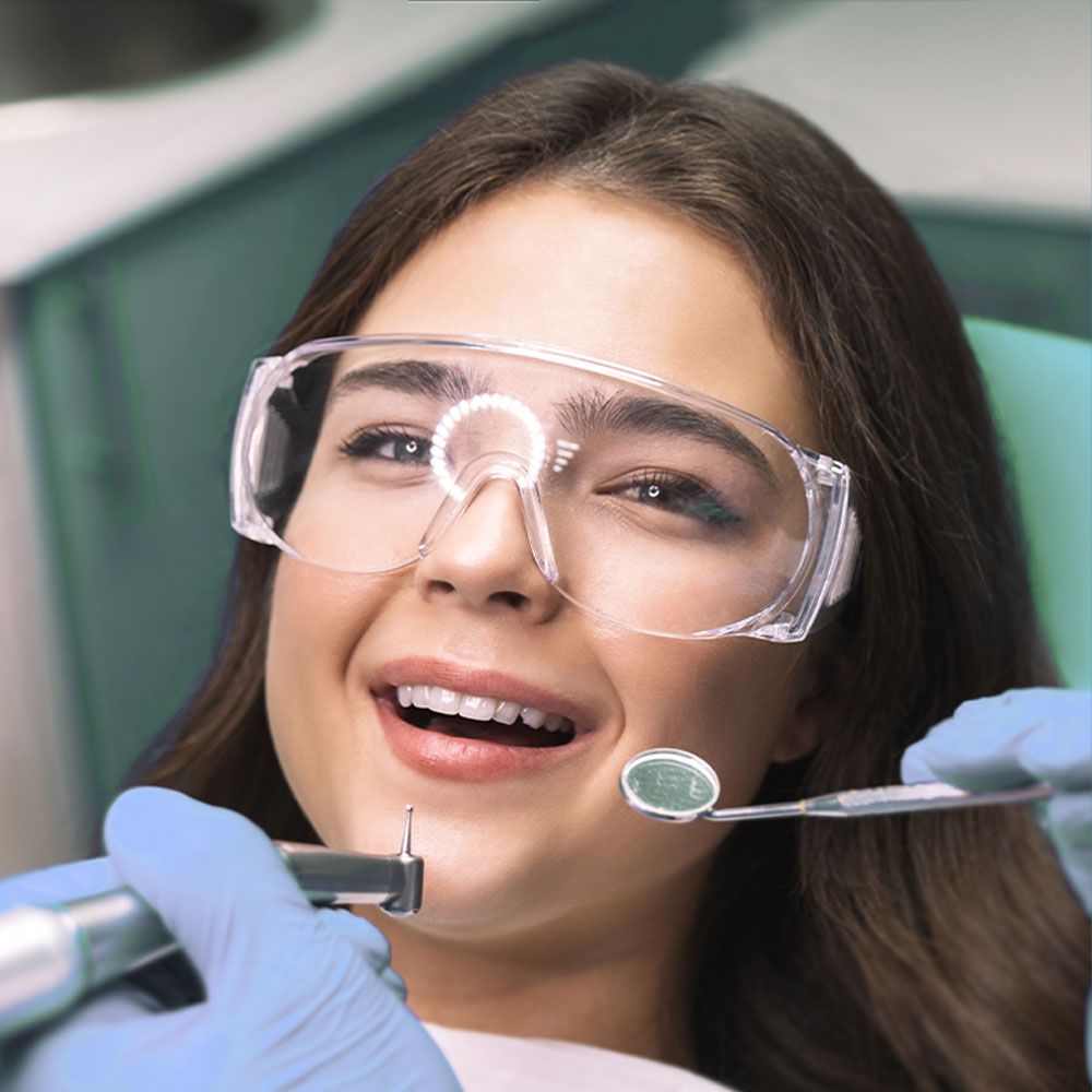 smiling woman receiving dental treatment